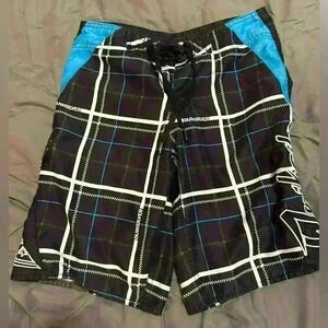 Boys Quicksilver shorts size 26 which works out to a small  black and blue